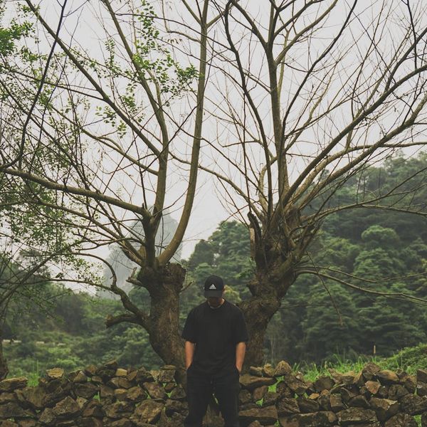 Person in a meditative pose in a calm, modern environment.